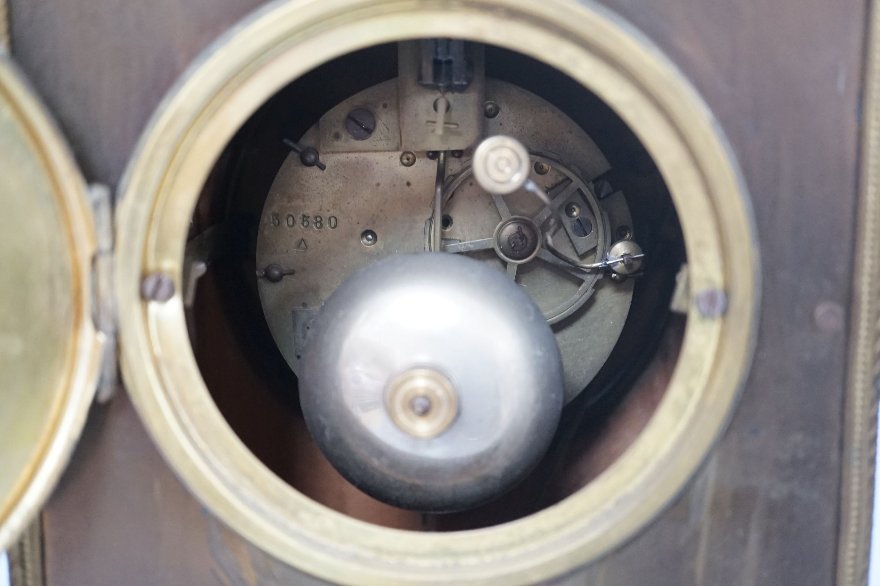 An early 20th century brass mantel clock, 40 cms high.